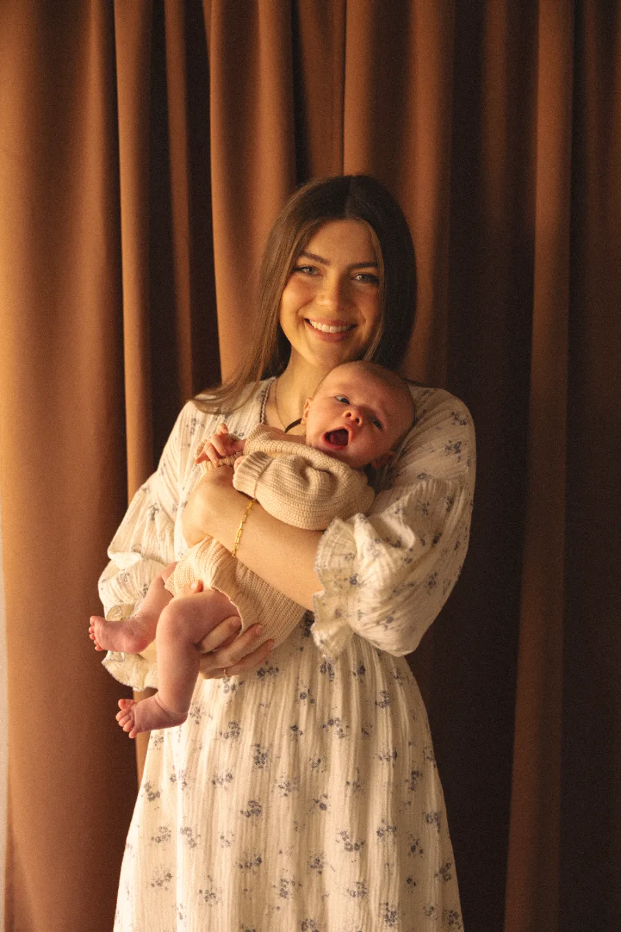 Madison Jeffery, CCC-SLP, pediatric speech-language pathologist and founder of Social House Therapy, holding her newborn